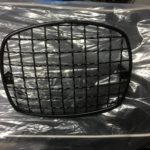 Scomadi TL black headlamp grille.